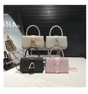 Group display of chic sequined handbags in gold silver black and pink with metal d-rings