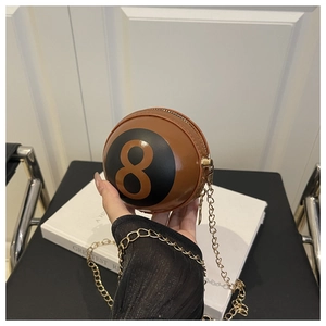 Detail of creative brown billiard 8-ball spherical chain bag with gold metal zipper