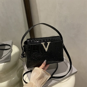 Elegant black crocodile pattern leather handbag with silver V-buckle and shoulder strap