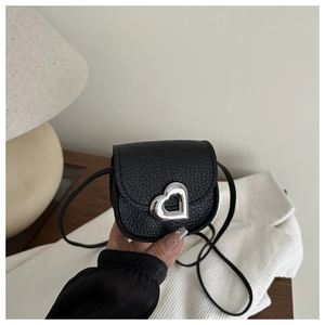 Mini heart buckle crossbody bag in black pebble leather with silver metal hardware detail