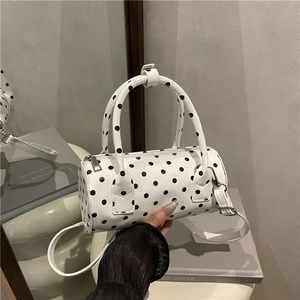 Retro white polka dot cylinder Boston bag with top handles and detachable shoulder strap