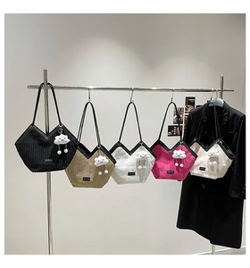 Detail of corduroy shoulder bags in five colors with cute cloud pendants and V-neck design