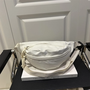 Minimalist white nylon dumpling cross-body bag with adjustable strap and buckle closure