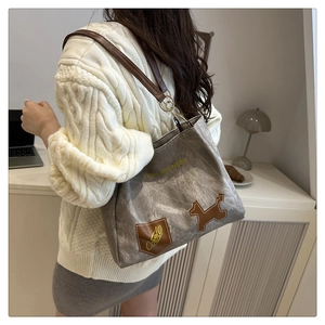 Retro grey canvas tote bag with brown leather straps and cool dog patch detail