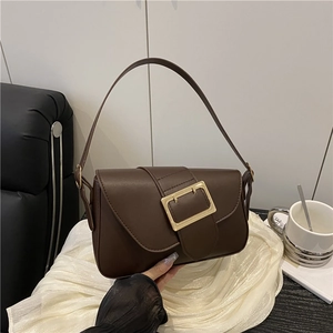 Retro brown leather underarm bag with a vintage square gold buckle and trapezoid structure
