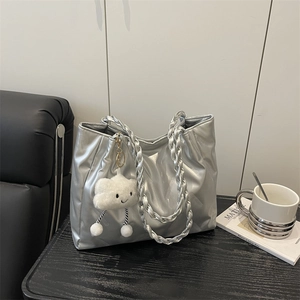 Minimalist silver quilted tote bag with pleated texture and plush cloud pendant