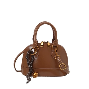 Vintage dark brown shell shaped handbag with detachable shoulder strap and gold hardware
