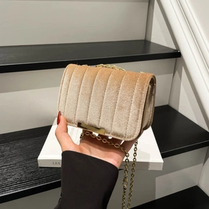 Champagne velvet chain bag with vertical quilting and elegant gold strap for women