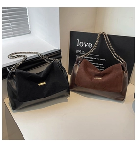 Detail of chain shoulder bags in black and caramel with matte suede and leather textures