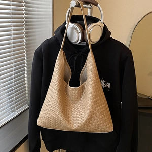 Large beige woven hobo tote bag for women with minimalist shoulder strap style