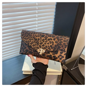 Chic leopard print envelope clutch bag with gold metallic clasp for evening parties