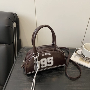 Dark brown crescent bowling bag with LOS ANGELES 95 print and detachable strap