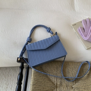 Blue woven minimalist small square handbag with V-shaped texture and gold hardware