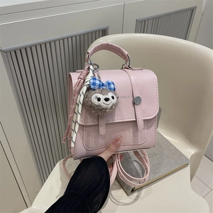 Pink mini vintage backpack with cute cartoon embossment and plush bunny charm