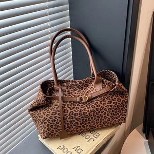 Leopard print tote bag with brown leather handles and golden buckles for women