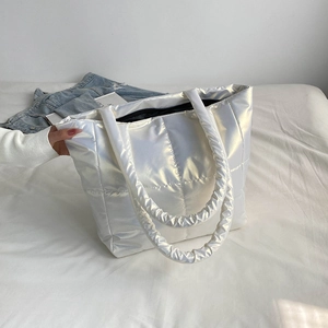 Quilted pearl white puffer tote bag with glossy finish and large padded shoulder straps