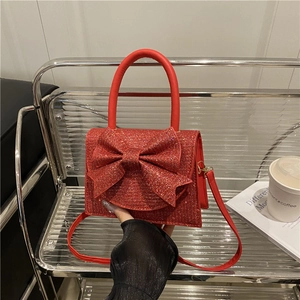 Sparkly red evening bag with oversized bow and top handle for women wedding parties