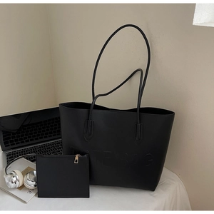 Detailed view of black large-capacity tote bag set with matching small zipper pouch
