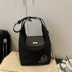Black canvas puppy tote bag with bone metal charm and large capacity for daily commute
