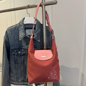 Minimalist red and pink tote bag with puppy embroidery and adjustable shoulder strap