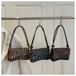 Three leopard print underarm bags in brown, grey, and coffee colors with knot straps