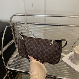 Vintage brown shoulder bag with all-over M letter print and silver zipper detail