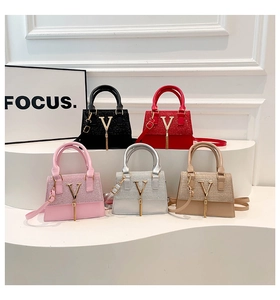 Detailed arrangement of stylish small square bags in five colors with V-logo and tassels