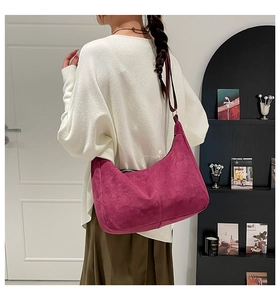 Detail of burgundy matte suede hobo bag showing high-quality texture and crescent shape
