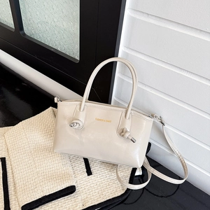 Chic beige PU leather tote bag with unique knotted handles and detachable shoulder strap