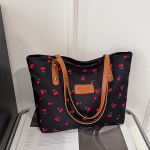 Sac fourre-tout noir à imprimé cerise avec poignées en cuir marron pour le quotidien