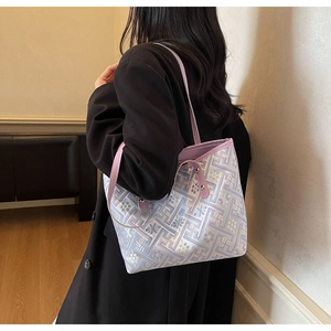 Lifestyle shot of large purple tote bag with traditional geometric pattern on woman shoulder