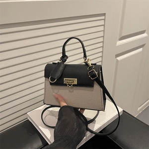 Chic contrast color crossbody bag with gold lock and black litchi grain texture