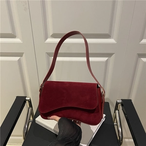 Chic burgundy suede shoulder bag with wave flap and magnetic closure for women