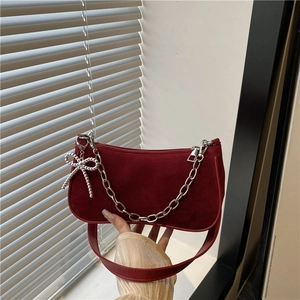 Burgundy matte suede shoulder bag with silver chain and bow pendant, retro style
