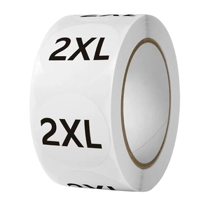Macro shot of 2XL round clothing size stickers on a roll for apparel retail