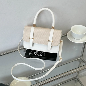 Fashionable white leather and beige woven crossbody bag with round handle and gold buckles