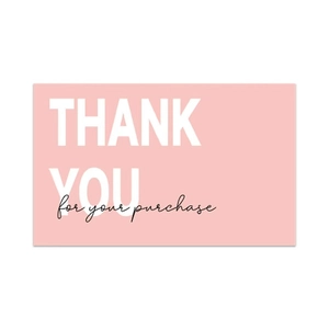 Close-up of pink floral Thank You card with white bold text for customer gift packaging