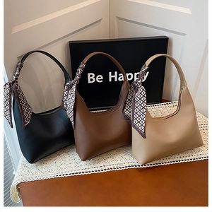 Three elegant hobo bags in black, coffee, and khaki with decorative silk scarf handles