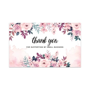 Detailed view of elegant pink floral thank you cards for small business gift packaging