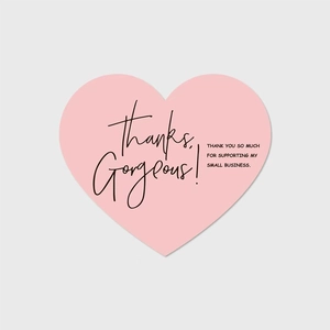 Close-up of pink heart-shaped thank you card for small business gift packaging