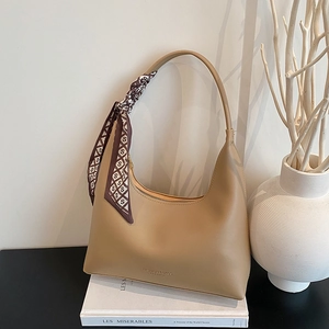 Khaki hobo shoulder bag with a decorative silk scarf and FASHION & BAGS LEATHER print