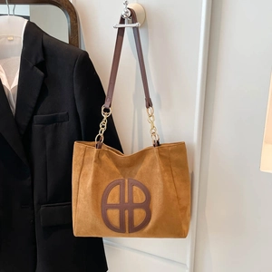 Brown faux suede large tote bag with leather straps and gold chain accents for women