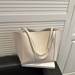 Minimalist cream tote bag with large capacity and thin shoulder straps for daily commute