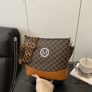 Brown monogram crossbody bag with retro letter print and wide geometric strap