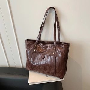 Large dark brown crocodile pattern faux leather tote bag with gold metal rivets