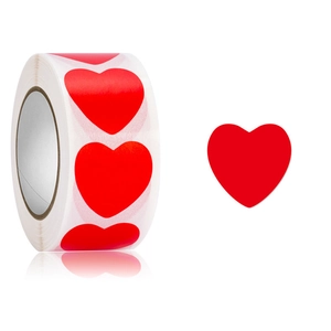 Roll of red heart-shaped stickers for Valentine gift wrapping with a mirror reflection