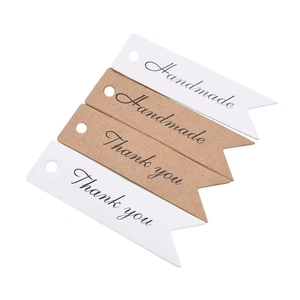 Vintage handmade paper gift tags in white and kraft colors with thank you lettering