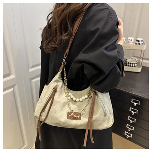 Retro grey-green canvas tote bag with brown leather straps and elegant tassel details
