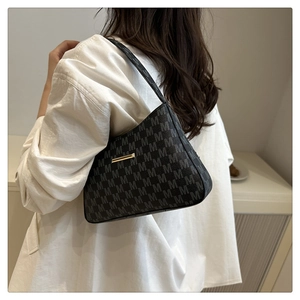 Detail of dark grey leather bucket bag with M jacquard pattern and gold metal buckle