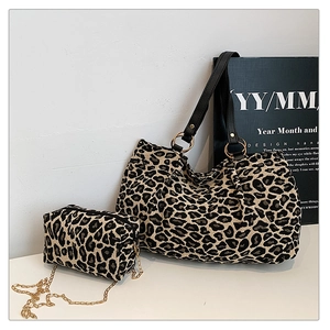 Detail of leopard print tote bag and mini chain purse set with gold hardware